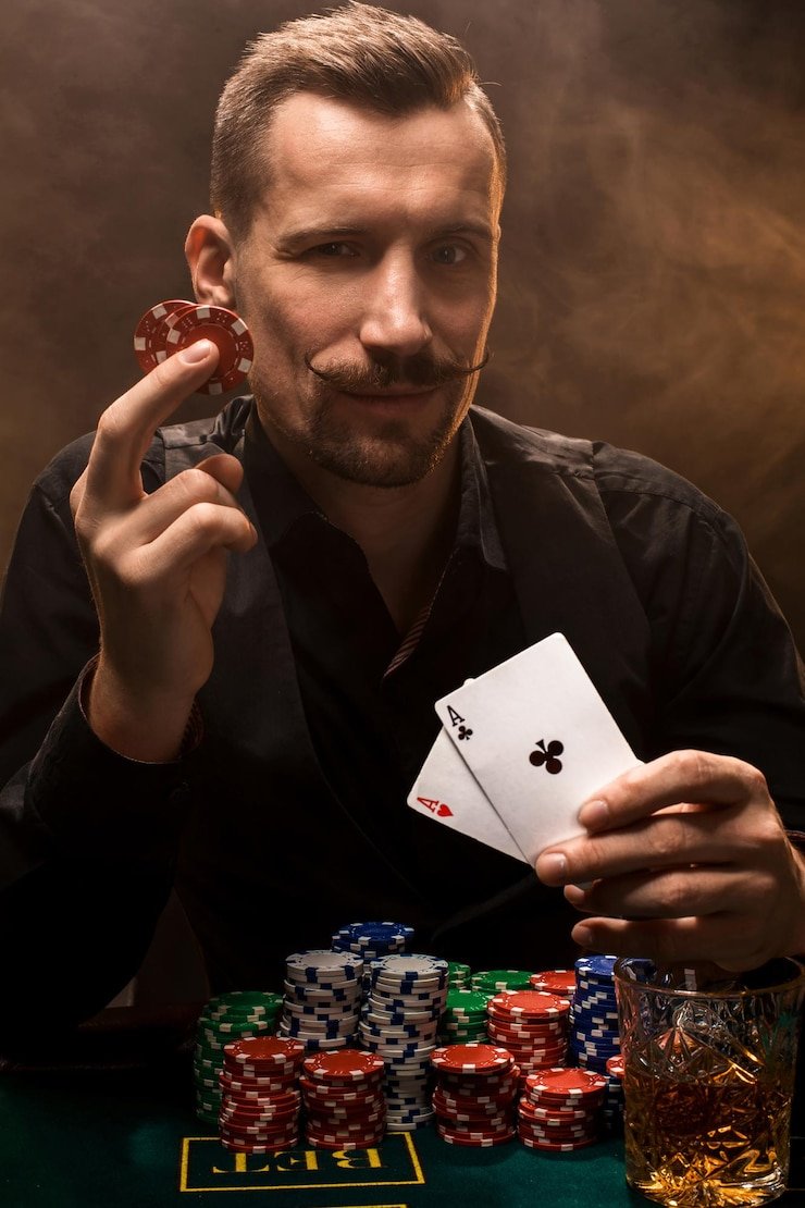 Close-up of playing cards and betting chips on a live baccarat table